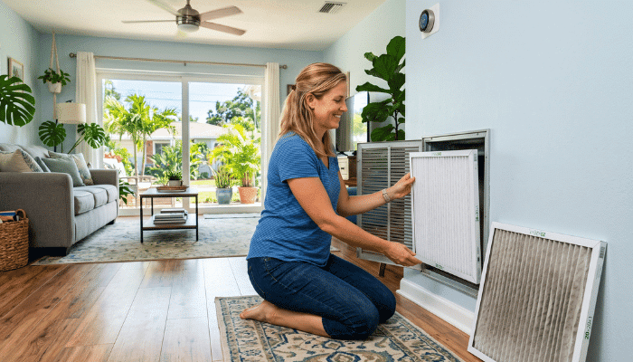Homeowner Changing An Hvac Air Filter In A St. Petersburg Fl Home