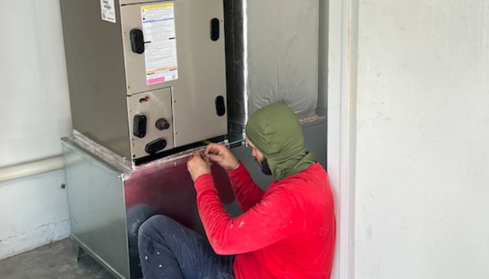 Technician Working On Furnace
